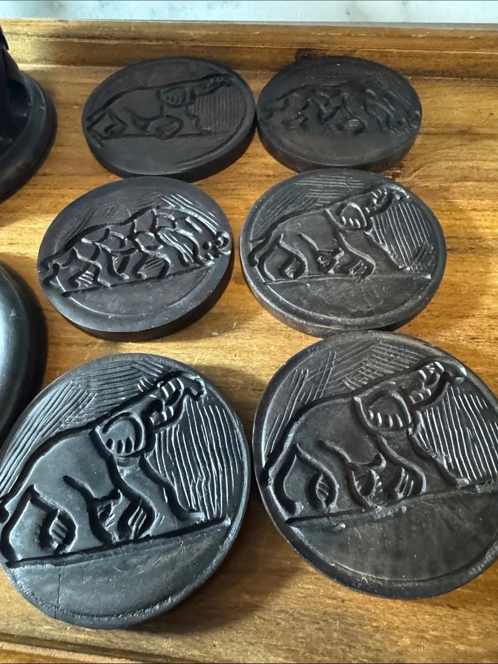 Carved Ebony Wooden Coasters with Intricate Safari Motifs